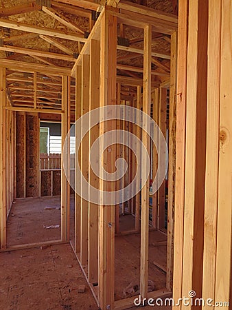 Passage inside a wooden house under construction