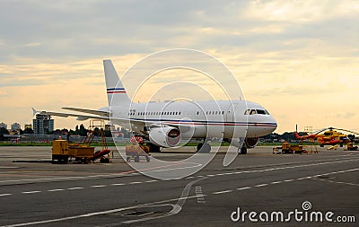 A passenger airliner in the parking lot