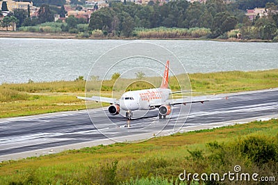 Passenger airplane landing to active runway