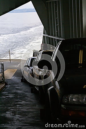 Passenger cars ride the Washington state ferry