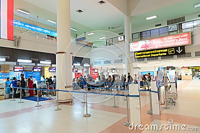 Passenger queue near check-in desks in airport