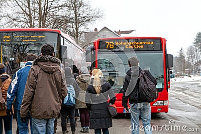 Passengers on bus stop entering arrived modern Hohenschwangau ca