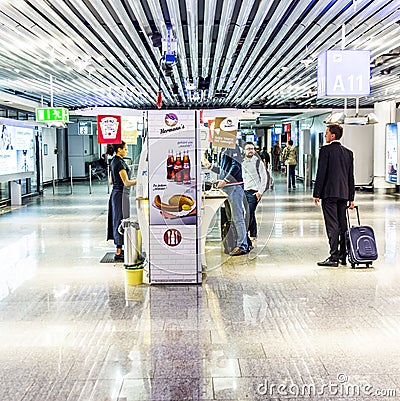 Passengers in the Departure Hall of Frankfurt International Airport