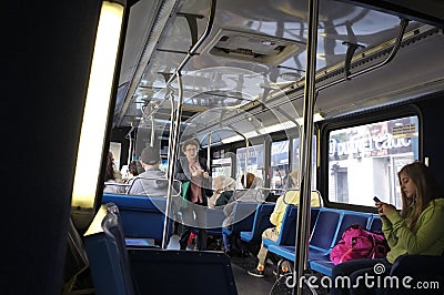 Passengers inside an MTA bus