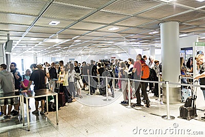 Passengers queue in the departure hall in the Frankfurt airport