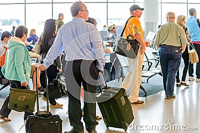 Passengers queued in line for boarding at departure gate