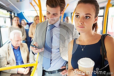 Passengers Standing On Busy Commuter Bus