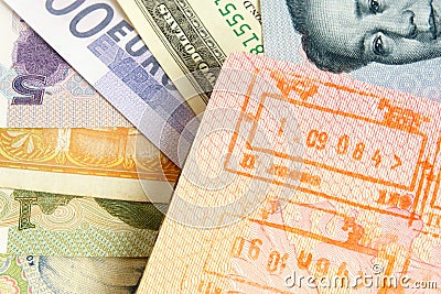 Passport with stamps on a different money