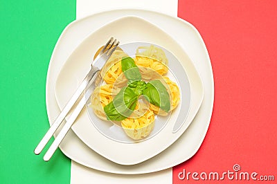 Pasta on italian flag with basil