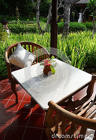 Patio furniture of a balinese garden