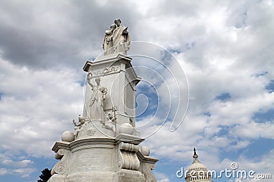 Peace monument, capitol and puffy clouds