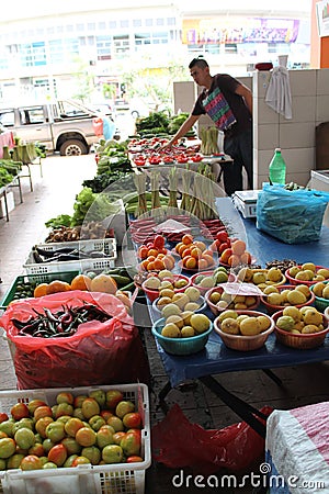 Peddler Sale vegetables in market