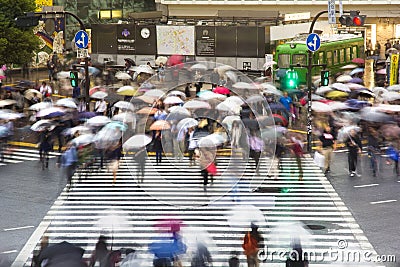 Pedestrians cross at Shibuya Crossing