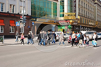 Pedestrians cross the street