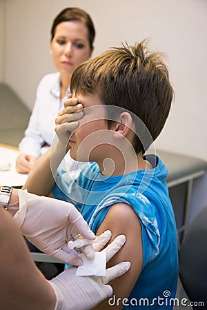 Pediatricians vaccinate a child