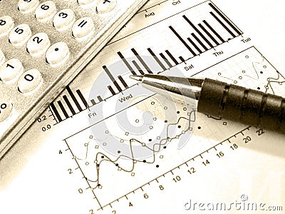 Pen and calculator against the graph (in sepia)