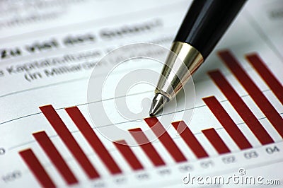 Pen showing diagram on financial report
