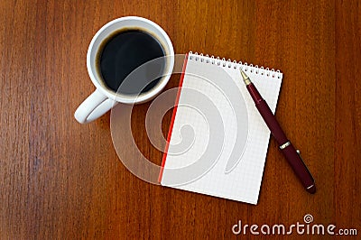 Pencil, coffee, notebook
