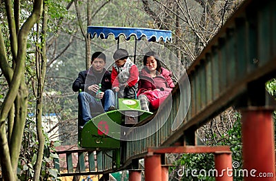 Pengzhou, China: Family at Amusement Park