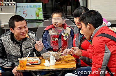 Pengzhou, China: Family Eating at Outdoor Restaurant