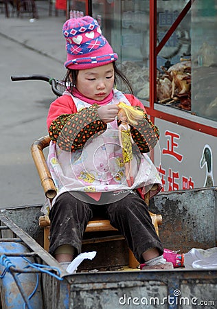 Pengzhou, China: Little Girl and Barbie Doll