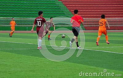 Pengzhou, China: Men Playing Football