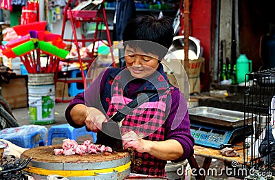 Pengzhou, China: Woman Chopping Fresh Chickens
