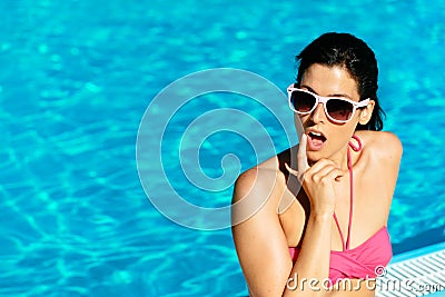 Pensive woman on summer at pool