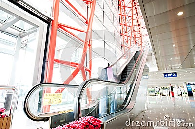 People at the airport escalator