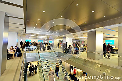People in Apple store interior in Hamburg city