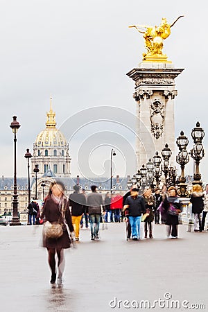 People on a bridge in Paris