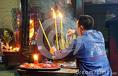 People burn incense at ancient temple
