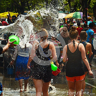 People celebrating Songkran or water festival in the streets