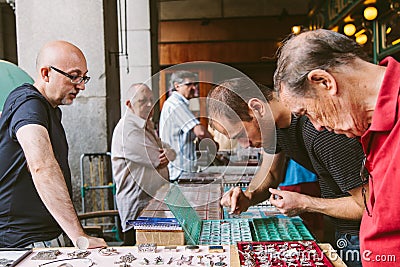 People at the Collectible Market of Stamps and Coi