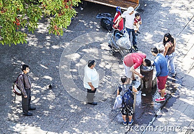 People cooling down during hot day.