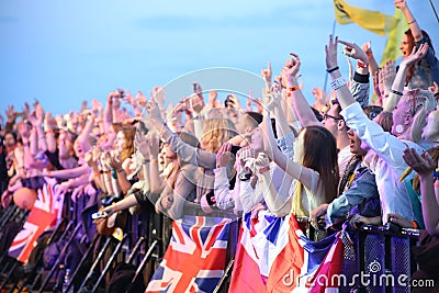 People crowd with british flags