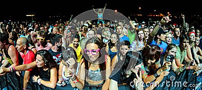People from the crowd (fans) watch a concert at FIB Festival