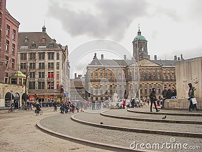 People on the Dam Square in front of Amsterdam Royal Palace . N