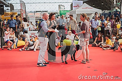People and dogs at Quattrozampeinfiera in Milan, Italy