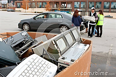 People Drop Off Electronics At Recycling Event