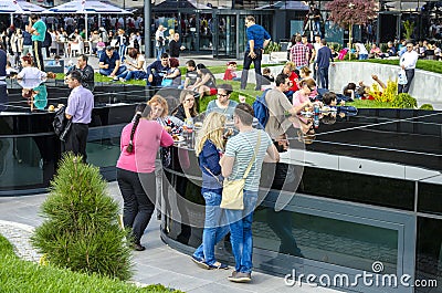 People eating and relaxing outdoor