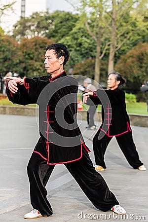 People exercising tai chi gucheng park shanghai china