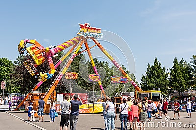 People Having Fun In Amusement Park