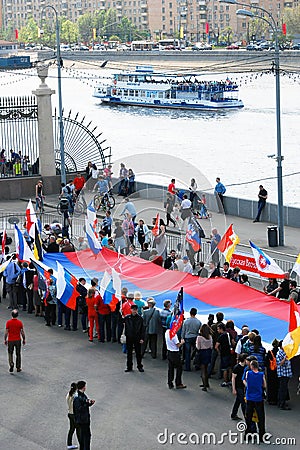 People hold a Russian flag.