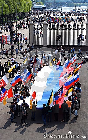 People hold a Russian flag. View of the Gorky park.