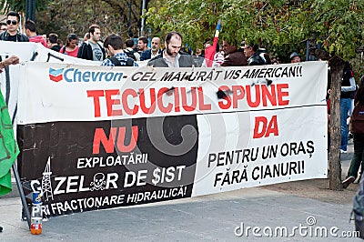 People holding a banner against Chevron
