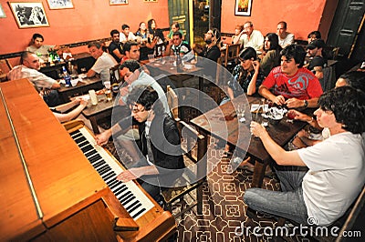 People listening at a music entertainment in a bar