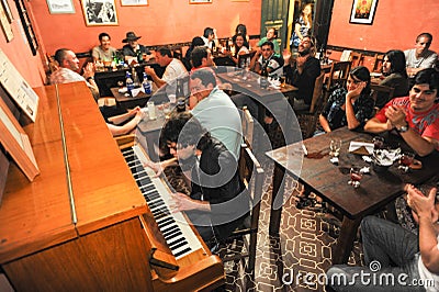 People listening at a music entertainment in a bar