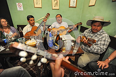 People listening at a music entertainment in a bar