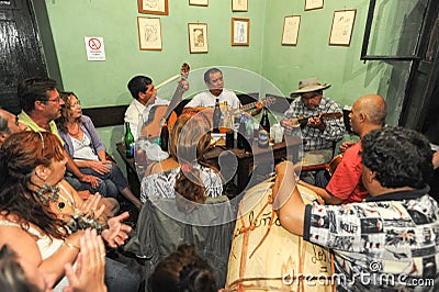 People listening at a music entertainment in a bar